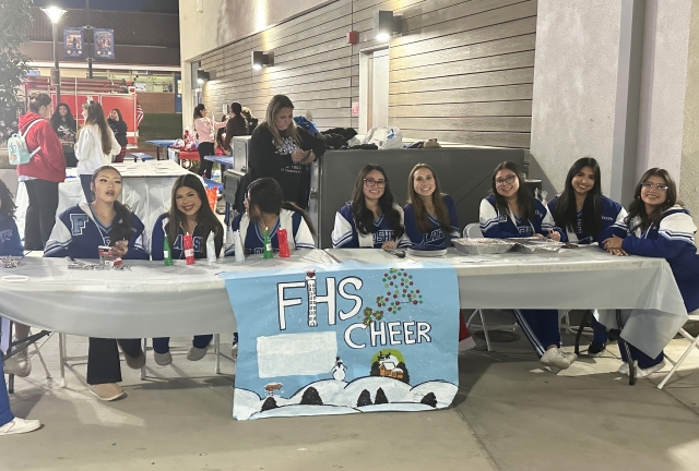 Fillmore High School welcomed its Annual Winter Wonderland on Friday, December 13th. Some of the activities offered were game tables & prizes, cornhole, snow bubbles machine, Big Brothers/Sisters, FHS Cheer (above), Candied Apples & Cake Pops, Face Painting (inset), Robotics (Dream it, Do it), Interact Club, FFA North Pole Casino, Social Equality, FFD Engine 91, Taco Truck, Mr. Softee, and of course, a picture with Santa! Even the Grinch grew a heart for the event. Photo credit Gazette staff. See more photos online at www.FillmoreGazette.com.
