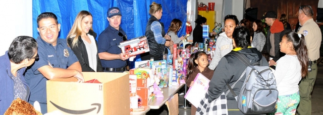 Pictured above is last year’s Annual Holiday Giveaway which will be held Saturday, December 12th from 9am to 12pm at the Veteran’s Memorial Building.