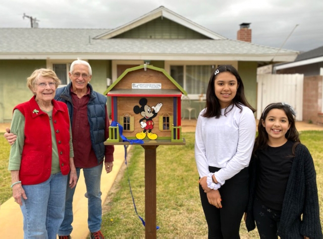 (left) Jolene and Jack Stethem with Yesenia and Alejandra Robles, the proud owners of the newest Free Little Library here in Fillmore which opened at 853 Oliver Street. 