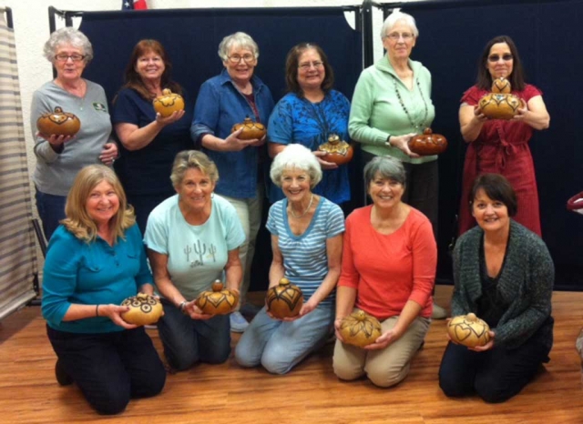 Fillmore Senior Center Gourd Class shows off the Gourds they have been working on. This is an advanced Class Taught by Charlene Smith on the first & third Tuesdays' of the month. Class members are:  Donna Voelker, Diana Hoslett, Shelley Johnson, Colleen Kyffin, Kathleen Johnston, Chris Garcia, Debby Curnett, Jean Westling, Karen Bagley, Lola Rogers, Michele Smith, Nancy Bowlin.