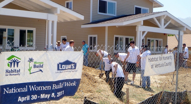 Volunteers fro Kavlico Corp in Moorpark and its parent company Custom Sensors Technology dig trenches and dip paint brushes last Saturday in Piru for Habitat for Humanity.