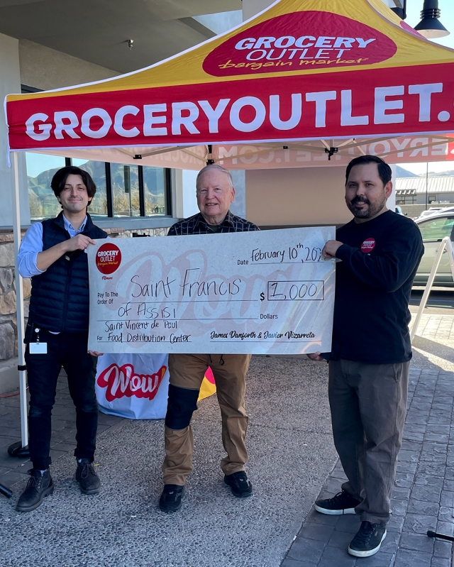 Fillmore’s Scott Lee accepting the check for $1,000 from Grocery Outlet’s new owners for St. Francis of Assisi St. Vincent de Paul Food Distribution Center. Photo credit Shane Morger, Bunnin Chevrolet of Fillmore.