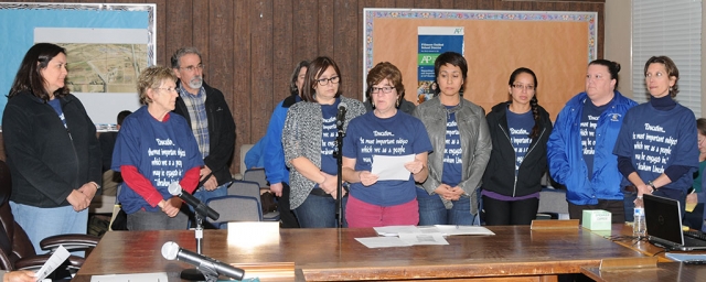 Teacher Sandy Butts, center, and fellow teachers addressed concerns at Tuesday night’s school board meeting.