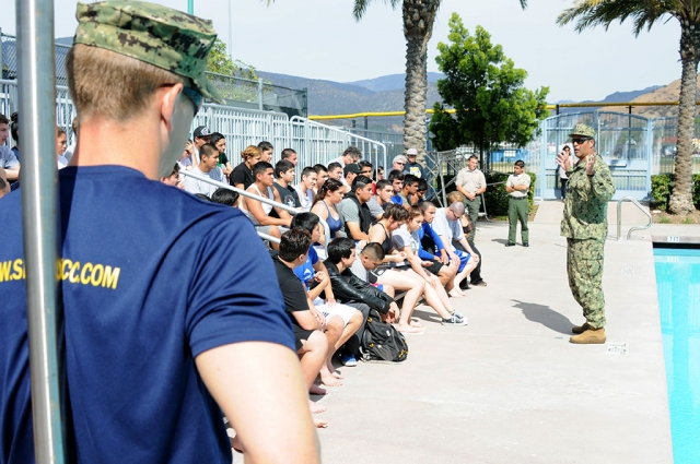 The United States Navy SEALs came to Fillmore last Wednesday, March 5th to run about four dozen Fillmore High School Juniors and Seniors through some rigorous military exercises. School administrators and members of the PTO attended for support. Several SEALs addressed 46 students, male and female, stressing they are interested in students from all backgrounds. Women cannot serve in the SEALs. Chief James Johnson and Recruiter Anthony Jimenez were just two of the SEALs who oversaw swimming five laps in five minutes, running a mile in seven minutes, and completing 15 pushups, 45 situps, and two pullups, all within two hours.One of the top five qualifiers, Chad Petuoglu, a FHS junior, ran a 7-minute mile, swam five laps, and completed eight pullups, 67 pushups, and 60 situps. FUSD Superintendent Alan Nishino visited the SEALs last year at the Amphibious Base Coronado, San Diego. SEAL MOTTO: ‘The only easy day was yesterday.’