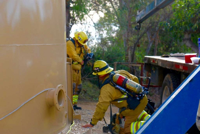 Following the motorcycle rescue, also on Tuesday, December 8th, at approximately 1:00pm, Fillmore Fire responded to a technical rescue of an unconscious worker trapped inside a large water tank in Somis. Urban Search & Rescue had to perform the rescue in full protective clothing because of hazardous materials. The man was harnessed out after an hour. He was transported to an area hospital in stable condition. Sheriff’s Air Squad 9, and paramedics also responded. Photos courtesy Sebastian Ramirez.