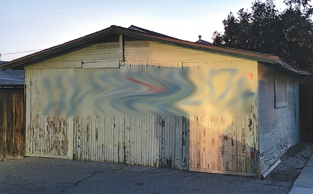 A defaced shed near Mountain View and 1st Street.