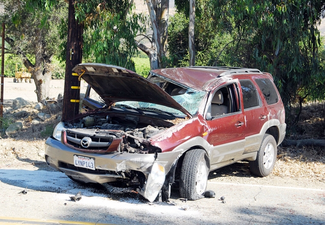 At approximately 11:00 a.m., Friday, ambulance, rescue, and Sheriff’s personnel responded to a vehicle accident call on Sycamore Road. An Infinity SUV had struck an abutment near Boulder Creek and overturned. The driver and passenger were found walking along the road when help arrived. No injuries were reported. The vehicle suffered significant damage.