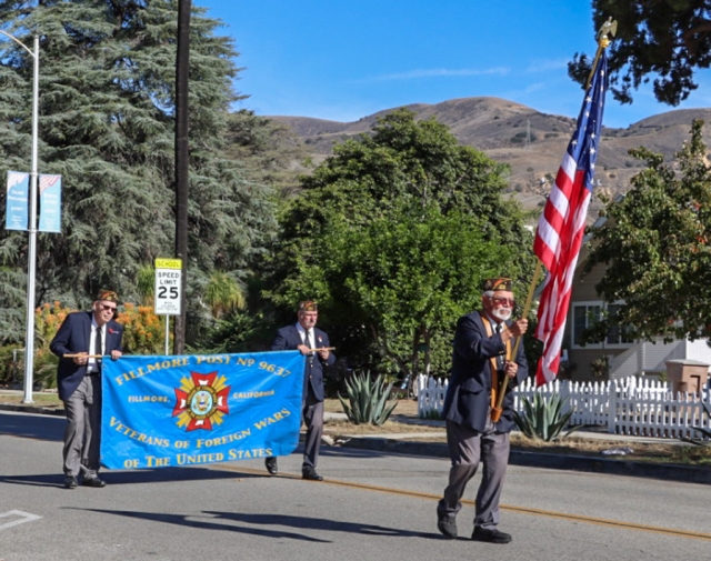 Young and old turned out to honor those who served their country on Friday, November 11th, Veterans Day. Central Avenue was filled with classic cars, motorcycles, Fillmore Fire Engine 91, Fillmore PD, FHS Marching Band, and more. Above, US Naval Sea Cadet Corps (Ben Moreell Battalion) marched in the parade. They are sponsored by the Ventura County Council of the Navy League of the United States. Sea Cadets train aboard U.S. Navy and Coast Guard ships and shore activities, and are authorized by the Secretary of the Navy to wear Navy uniforms marked with Naval Sea Cadet insignia. They participate in parades, color guards, marksmanship training, fireman training, and other activities, as well as community service activities. Inset, Fillmore's own VFW Post 9637, representing the many Fillmore veterans who have proudly served in the military. Photo credit Angel Esquivel AE News.