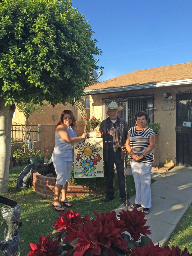 Theresa Robledo, assisting with the presentation of Fillmore Vision 2020 Civic Prideâs Yard of the Month for May awarded to Mr. Barajas (photo with his daughter, Margarita) Congratulations! Please drive by their yard located at 352 Mountain View, you will find beautiful variations of Geraniums, Pointsettias, lovely trees, and rose bushes all maintained by Mr. Barajas. When Mr. Barajas was describing why there were no roses on his rose bushes, he mentioned that his wife recently passed away and he cut them all to take them to her gravesiteâŚholding back the tears, I was honored to present him with this recognition. A Big Thank you to Otto & Sons Nursery for providing a gift certificate to Mr. Barajas, where he will find more to add to his lovely garden!