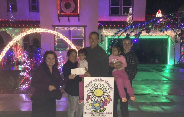 Theresa Robledo presents Fillmore Civic Pride Vision 2020 Yard of the Month along with a generous gift Certificate from Otto & Sons Nursery for $40.