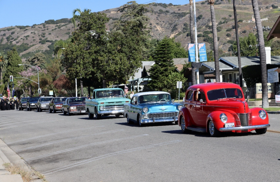 Pictured are classic cars which carried Fillmore and Piru Veterans down Central Avenue in this year’s parade and future cadets marching to close out the parade with the Fillmore Police & Fire Departments following. Thank you for serving your country. Photo credit Angel Esquivel-AE News.
One of the traditions was the presentation of each branch of service flag and medley. As each branch was recognized, the veterans of that branch stood and saluted as the medley played.