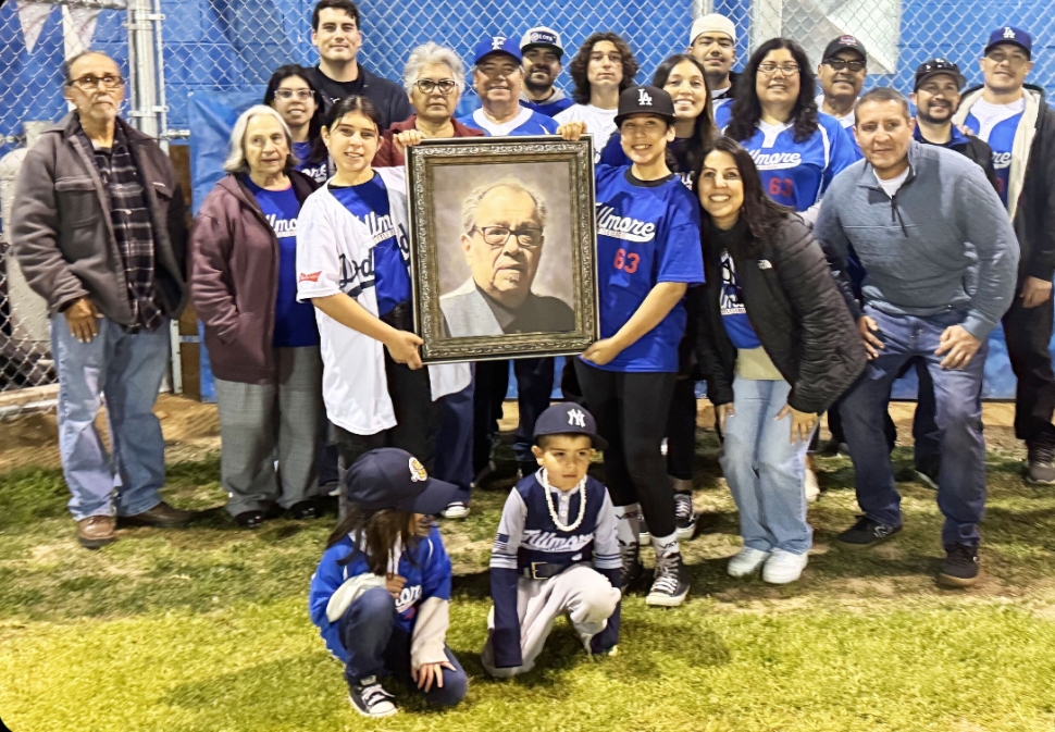 On Friday night, February 28th, Fillmore Little League (FLL) held opening ceremonies for the 2025 season. Dora Sanchez sang the National Anthem. Jack Morales in honor of his brother David “Mucho” Morales started off the season with their family on the mound and behind the plate. Teams filled up fast this season and baseball is off with a crack of the bat. Don’t forget to swing by the snack bar for the famous chili cheese fries and some FLL fan gear! Thank you FLL and all the volunteers who make this possible! Thank your umpire! Pictured above is the Morales Family with FLL board members, David’s brother Jack and family. Photo credit Brandy Hollis. More photos online at www.FillmoreGazette.com.