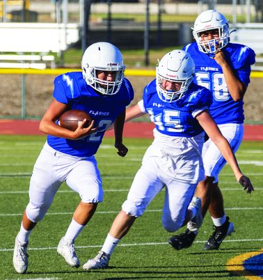 Above is a Flashes JV player making a tackle in the Blue and White Scrimmage game last Friday as they get ready to kick off the 2024 season this Friday. Photo credit Crystal Gurrola.