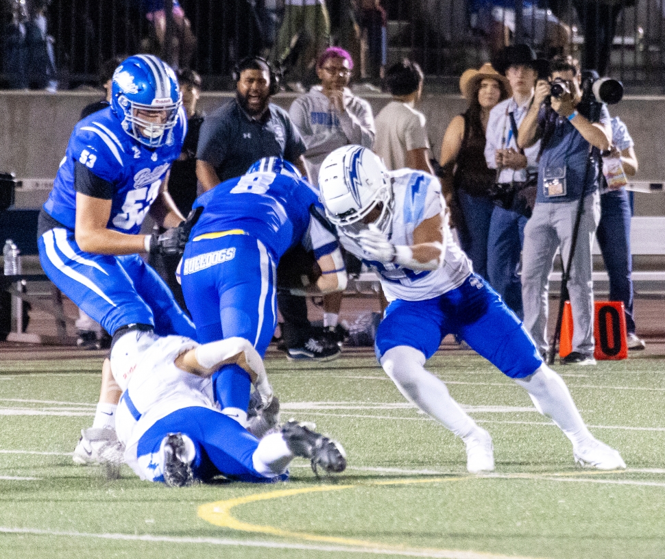 Pictured right is Flashes Varsity stopping a Bulldog in his tracks to keep him from advancing down the field. Photo credit Crystal Gurrola.