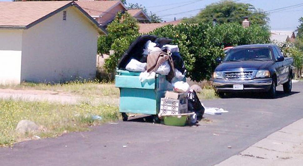 Trash left uncollected near A Street and Blaine Avenue attracks flies rodents.