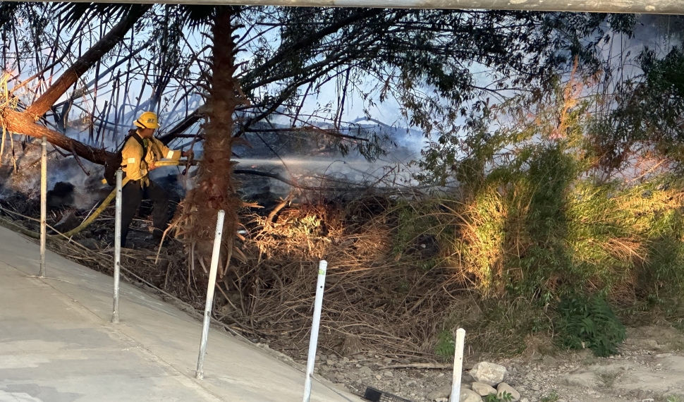 A vegetation fire started on Friday, August 11th, at 7:00pm, under the Chambersburg/23 Bridge, by the bike path. Crews worked quickly to get it under control, and the bridge was closed to through traffic until approximately 10:45pm. At least eight units responded, including Fillmore City Fire and Ventura County Fire. The fire started in proximity to a homeless encampment and spread by embers from three ignited Palm trees. One acre was burned. This is the third fire in that area commonly caused by fires built in the camps for cooking or staying warm, and perhaps drug use, according to Fillmore Fire Chief Keith Gurrola. A fourth fire was ignited by 2 Rivers Park a couple of months ago, under investigation. Restitution for fire personnel cannot be collected in these incidences, with the burden falling on taxpayers. Chief Gurrola stated that he is pursuing a grant in conjunction with the Ventura County Fire Department for “hazard reduction” from an approximately $3 million Ventura County Fire Safe Council/Cal Fire (CA Dept. of Forestry & Fire Protection) grant, part of a state-wide $113 million wildfire prevention grant. See details below.