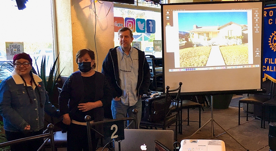 Oliva and her mother, homeowner Bene Ambrosio, with Sean McCulley. Ambrosio’s home was chosen for the Rotary Club’s House Painting Project. Photo courtesy Rotarian Martha Richardson.