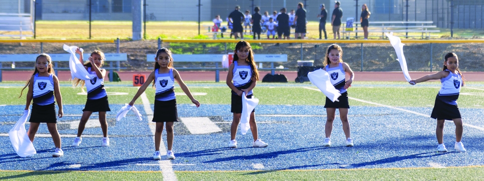 Pictured above are the Fillmore Raiders Mighty Mite Black and Silver Cheer squads during their halftime performance last Saturday. Photo credit Crystal Gurrola. More Raiders Cheer photos online at www.FillmoreGazette.com.