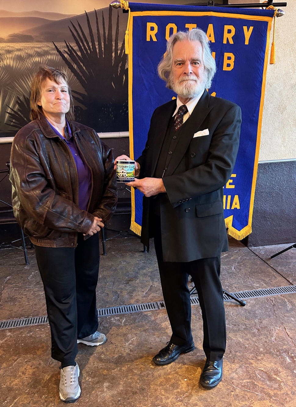 Last week the Fillmore Rotary program was presented by Gem Munro, from Amarok Society, an international program the club has been sponsoring for three years. They are located in Bangladesh where the children are not educated at all. He and his wife started a school where they began by teaching the mothers and followed up with each mother teaching her children. There was a video of a young woman who started out this way and as she grew up, she began teaching and is now going to University. These women and children have gained confidence and are learning both languages and are now respected by their families and the community. Pictured is Rotary President Anna Reilley and speaker Gem Munro. Photo credit Martha Richardson.