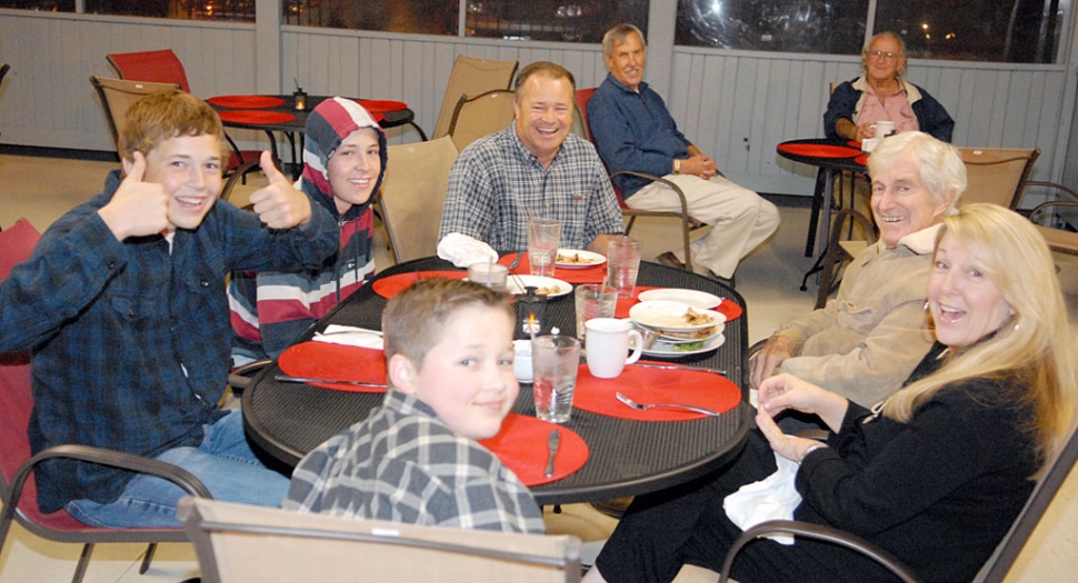 Double AA Cafe held their Grand Opening last Saturday night. Pictured above, the Morris family enjoy each others company after dinner. The restaurant is now open for breakfast, lunch and dinner. Please call for hours.