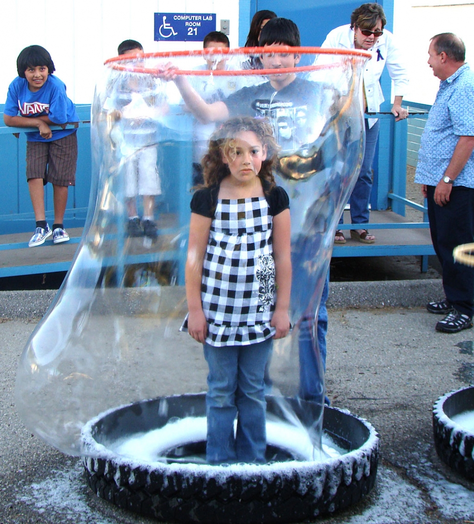 This cute Bubble Girl is surrounded by a soapy sphere with an iridescent surface – commonly known as a bubble!