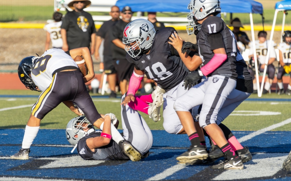 On Saturday, September 7, Fillmore Raiders Seniors Silver took on San Fernando. Above are some Raiders taking down a Tiger to keep him from advancing. Final score, Raider Seniors Silver-6, San Fernando Crossroads Tigers-33. Photo credit Crystal Gurrola. 