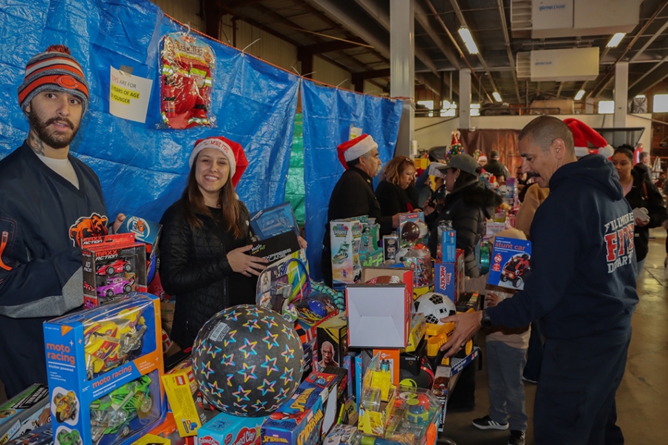On Saturday morning, December 17th, Fillmore residents lined up at the Fillmore Fire Station for the Annual Toy Giveaway. Each Child took a picture with Santa Claus and received a new toy, book, new coat and socks. Cotton Candy and popcorn were also handed out. The children and their families were able to visit with first responders and learn safety tips while enjoying the event. Photo credit Angel Esquivel-AE News.