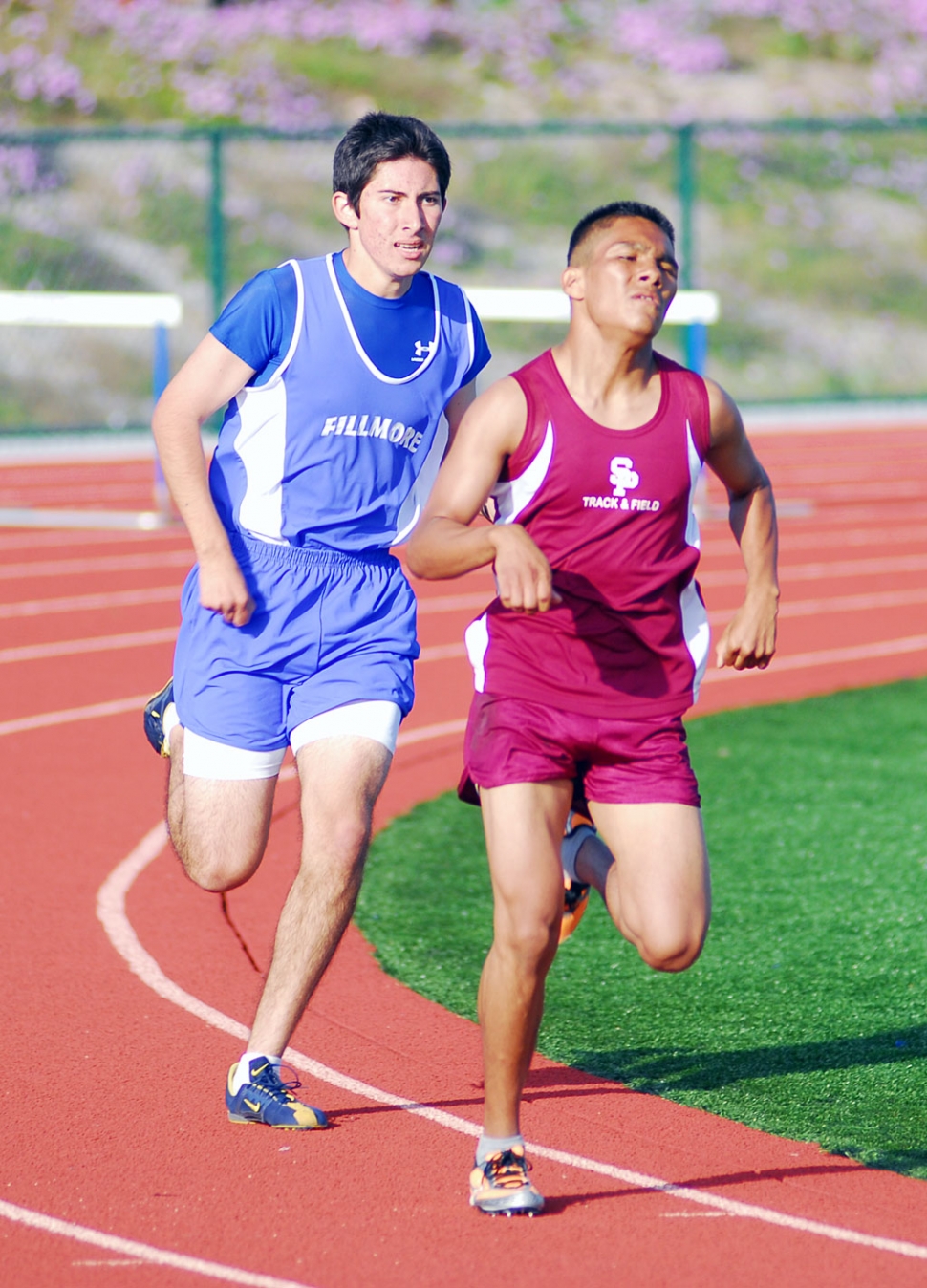 Anthony Chavez runs against his Santa Paula opponent.